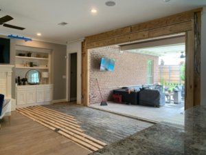 Completed wall to door conversion with glass sliding doors by Load Bearing Wall Pros